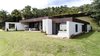 Modern home with Exterior, Flat RoofLine, Metal Roof Material, House Building Type, and Stone Siding Material. Fachada Photo 6 of Entremuros House