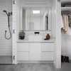 Modern home with Bath Room, Ceramic Tile Wall, Subway Tile Wall, Carpet Floor, Open Shower, Porcelain Tile Floor, Vessel Sink, Wall Lighting, and Engineered Quartz Counter. Simple bathroom and robes with white cupboards and tiling allow light to permeate through the internalised space Photo 6 of Preston 1