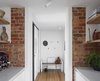 Modern home with Light Hardwood Floor. Texture of existing brick to the kitchen and v-grooved timber lining to the entry provide warmth with fresh white maximises light throughout. Photo 14 of Preston 1