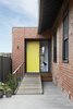 Modern home with Exterior, House Building Type, Metal Roof Material, Flat RoofLine, Brick Siding Material, and Small Home Building Type. New entry with easy access for all Photo of Preston 1