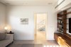 Modern home with Living Room, Sofa, Bookcase, Table Lighting, Ceiling Lighting, and Limestone Floor. Family media room Photo 9 of Harimon House