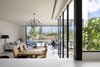 Modern home with Dining Room, Table, Limestone Floor, Ceiling Lighting, Pendant Lighting, and Chair. Tree top visible at ground floor Photo 4 of Harimon House