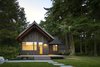Modern home with Exterior, Gable RoofLine, Wood Siding Material, Metal Roof Material, and Cabin Building Type. Sleeping Cabin at sunset. Photo 7 of Island Cabins