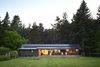 Modern home with Exterior, Cabin Building Type, Metal Roof Material, Gable RoofLine, and Wood Siding Material. Long Cabin from south lawn at dawn. Photo 5 of Island Cabins