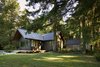 Modern home with Exterior, Cabin Building Type, Gable RoofLine, Metal Roof Material, and Wood Siding Material. Sleeping Cabin from southeast lawn and existing storage shed beyond. Photo 2 of Island Cabins