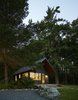 Modern home with Exterior, Metal Roof Material, Wood Siding Material, Cabin Building Type, and Gable RoofLine. Sleeping Cabin at dawn. Photo of Island Cabins