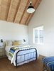 Modern home with Bedroom, Wall Lighting, and Bed. Sleeping Cabin guest bedroom. Photo 11 of Island Cabins