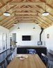 Modern home with Dark Hardwood Floor. Long Cabin dining and living rooms. Photo 13 of Island Cabins
