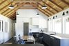Modern home with Wall Lighting and Dark Hardwood Floor. Long Cabin Kitchen. Photo 14 of Island Cabins
