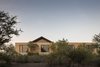Modern home with Exterior, A-Frame RoofLine, House Building Type, and Concrete Siding Material. the project integrates the construction to its natural landscape. Photo of Casa Moulat