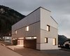 Modern home with Exterior, Wood Siding Material, Metal Roof Material, Shed RoofLine, House Building Type, and Flat RoofLine. MWArchitekten utilized local wood to harmonize the home's interiors with its facade. Photo of Semi detached house on a hillside