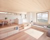 Modern home with Living Room, Light Hardwood Floor, Chair, Ceiling Lighting, Recessed Lighting, Sofa, Bench, and Bookcase. Living Room 01 Photo 2 of Semi detached house on a hillside
