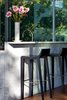 Modern home with Kitchen, Medium Hardwood Floor, White Cabinet, and Marble Counter. Detail of the kitchen countertop and marble slabs Photo 10 of North Beach Residence