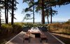 Modern home with Outdoor, Gardens, Decking Patio, Porch, Deck, Grass, Hardscapes, Trees, Walkways, Shrubs, and Flowers. The patio just adjacent to the kitchen makes for perfect outdoor dining Photo 19 of North Beach Residence