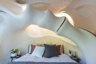 Get some shut eye in the cavernous master bedroom, furnished with midcentury-inspired West Elm furniture.
