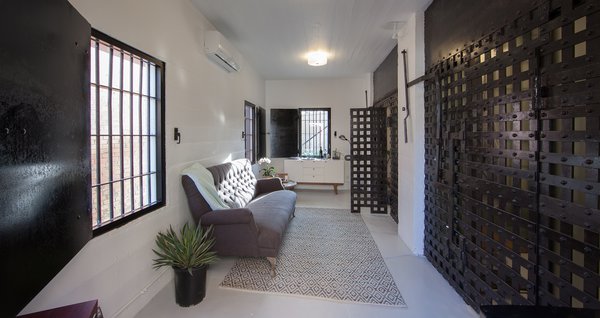The 300-square-foot space feels much larger than it is with plenty of light and monochromatic decor.