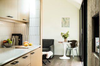 The kitchenette features ridge-sawed white oak cabinetry and white 2" x 8" subway tiles. "The tiles were a very reasonable price, which allowed us to do more with the space," Finnell says.