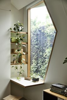 The shape of the window is meant to represent Pam. 