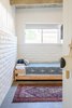 Modern home with Bedroom. In the kid-friendly bunk room, Lewis went with Natalie Meyers Veneer Design daybeds, a light from Frances and Son, accessories from The Garage Collective (Lewis's own store), and stump side table she made herself. Photo 5 of Borrego Springs Midcentury