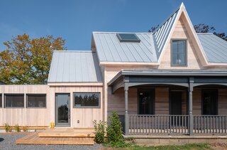 The new exterior is much more weather-resistant, and the porch mimics the shape of the original.