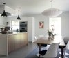 Modern home with Kitchen, White Cabinet, Ceramic Tile Floor, Wood Cabinet, Pendant Lighting, Engineered Quartz Counter, and Wall Oven. Kitchen and Dining Room Photo 5 of AU Park Addition / Renovation