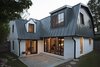 Modern home with Outdoor, Walkways, Grass, Back Yard, Hardscapes, Small Patio, Porch, Deck, Pavers Patio, Porch, Deck, and Boulders. Rear Elevation Photo of AU Park Addition / Renovation