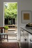 Modern home with Kitchen, Engineered Quartz Counter, and Medium Hardwood Floor. New Exterior connection via Kitchen Photo 12 of Albemarle Addition / Renovation