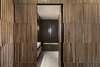 Modern home with Doors, Folding Door Type, Wood, and Interior. The modular distribution was designed to provide a uniform façade, which does not reveal the location of cupboard doors, or an entry door into the other space or any fixed section. This unit ‘turns’ and continues into the internal parts of the bathrooms. Photo 9 of The Layers apartment