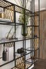 Modern home with Living Room, Bookcase, Medium Hardwood Floor, and Ceiling Lighting. The texture of the perforated brass is repeated in the floating library, which is a composition of layered shelving, which appears as thin, floating shelves providing an overall result that is elegant, light and airy. Photo 10 of The Layers apartment