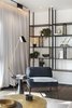 Modern home with Living Room, Medium Hardwood Floor, Lamps, Coffee Tables, Shelves, and Chair. Links between the forms and the materials, textures, objects and art. Photo 16 of The Layers apartment