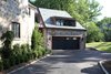 Modern home with Exterior, Hipped RoofLine, House Building Type, Shingles Roof Material, and Stone Siding Material. Garage Addition Photo 17 of Sterling Ridge