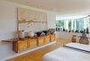 Modern home with Bedroom. Bedroom featuring a customized, remote-controlled mechanized wall system to hide a flat-screen tv with artwork Photo 6 of The Grotta House