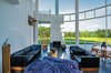 Modern home with Living Room. Living room - textiles: art by Sheila Hicks, Helena Hernmarck; table: Edgar and Joyce Anderson; chair: Hiroki Takada; sofa: Mies van der Rohe; bird: John McQueen; ceramics: Maija Grotell, Toshiko Takaezu, Wayne Higby
Photo 2 of The Grotta House