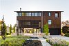 Modern home with Outdoor, Front Yard, Gardens, and Wood Fences, Wall. Narrow- growing beech and sweetgum trees do not obstruct views to and from the home but create scale and connection to the ground plane. Photo of Magnolia Modern