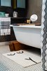 Modern home with Bath Room and Open Shower. BATH MAT / Cold Picnic (Brooklyn, NY)
SHOWER CURTAIN / Tressa Lavinia Linzy Designs (Fernandina Beach, FL)
WALNUT BATH TRAY / Protea & Pine (Denver, CO)
CANDLE / North + 29 Candle Co (Castle Rock, CO)
ROCKY MOUNTAIN MIRROR / soft co. (Philadelphia, PA)
PAPER PRODUCTS / Who Gives A Crap (Melbourne, Victoria)
MUDCLOTH COASTERS / Reflektion Design (Los Angeles, CA) Photo 6 of The Sursy Lincoln Park