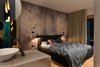 Modern home with Bedroom, Lamps, Bed, and Wall Lighting. Bedroom Photo 7 of A Place of Elegant Comfort
