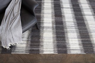 Kata rug is a flatwoven ikat realized in soft-spun wool.