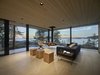 Modern home with Living Room, Ottomans, Hanging Fireplace, Light Hardwood Floor, and Wood Burning Fireplace. The archipelago is an integral part of the villa. Photo 3 of Villa Kivi