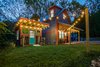 Modern home with Exterior, Shed RoofLine, Tiny Home Building Type, Metal Siding Material, Concrete Siding Material, Metal Roof Material, Wood Siding Material, Gable RoofLine, and Stucco Siding Material. Front of house and shed/bike shop Photo of Mountain Bikers Tiny House Getaway