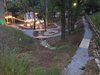 Modern home with Outdoor, Hardscapes, Slope, Trees, Woodland, Walkways, Back Yard, and Hanging Lighting. Bike Track Photo 3 of Mountain Bikers Tiny House Getaway