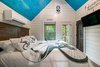 Modern home with Dark Hardwood Floor. master bedroom Photo 13 of Mountain Bikers Tiny House Getaway
