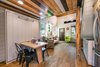 Modern home with Dining Room, Dark Hardwood Floor, Vinyl Floor, Ceiling Lighting, and Table. murphy bed with built in foldable table Photo 10 of Mountain Bikers Tiny House Getaway