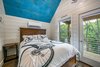 Modern home with Dark Hardwood Floor. master bedroom Photo 14 of Mountain Bikers Tiny House Getaway
