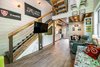 Modern home with Dark Hardwood Floor and Vinyl Floor. stairs with custom engraved mountain biker hidden drawer Photo 11 of Mountain Bikers Tiny House Getaway