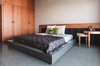 Modern home with Bedroom, Ceiling Lighting, Bed, and Wardrobe. Bedroom Photo 5 of Jungalow