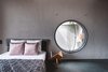 Modern home with Bedroom, Bed, and Ceiling Lighting. Play of fenestration in bedroom Photo 4 of Jungalow
