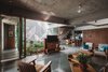 Modern home with Living Room, Chair, End Tables, Sofa, Coffee Tables, and Ceiling Lighting. Ground floor view from entry Photo 19 of Jungalow