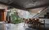 Modern home with Dining Room, Shelves, Storage, Ceiling Lighting, Table, and Chair. View of dining and courtyard Photo 10 of Jungalow