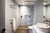 Modern home with Bath Room, Ceramic Tile Wall, Stone Counter, Ceramic Tile Floor, Recessed Lighting, Open Shower, Wall Lighting, Vessel Sink, and One Piece Toilet. SECOND FLOOR - MASTER BATHROOM
Photo © Ashok Sinha Photo 6 of Bed-Stuy Townhouse