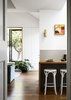 Modern home with Kitchen, Wall Lighting, Medium Hardwood Floor, Wood Counter, Wood Cabinet, White Cabinet, Ceiling Lighting, Drop In Sink, and Ceramic Tile Backsplashe. Kitchen Photo 3 of Coburg House